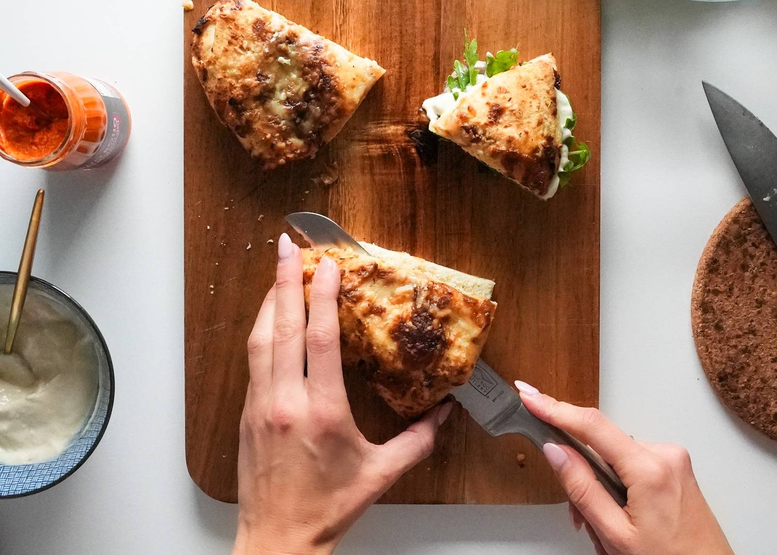 Slicing caramelized onion bread.