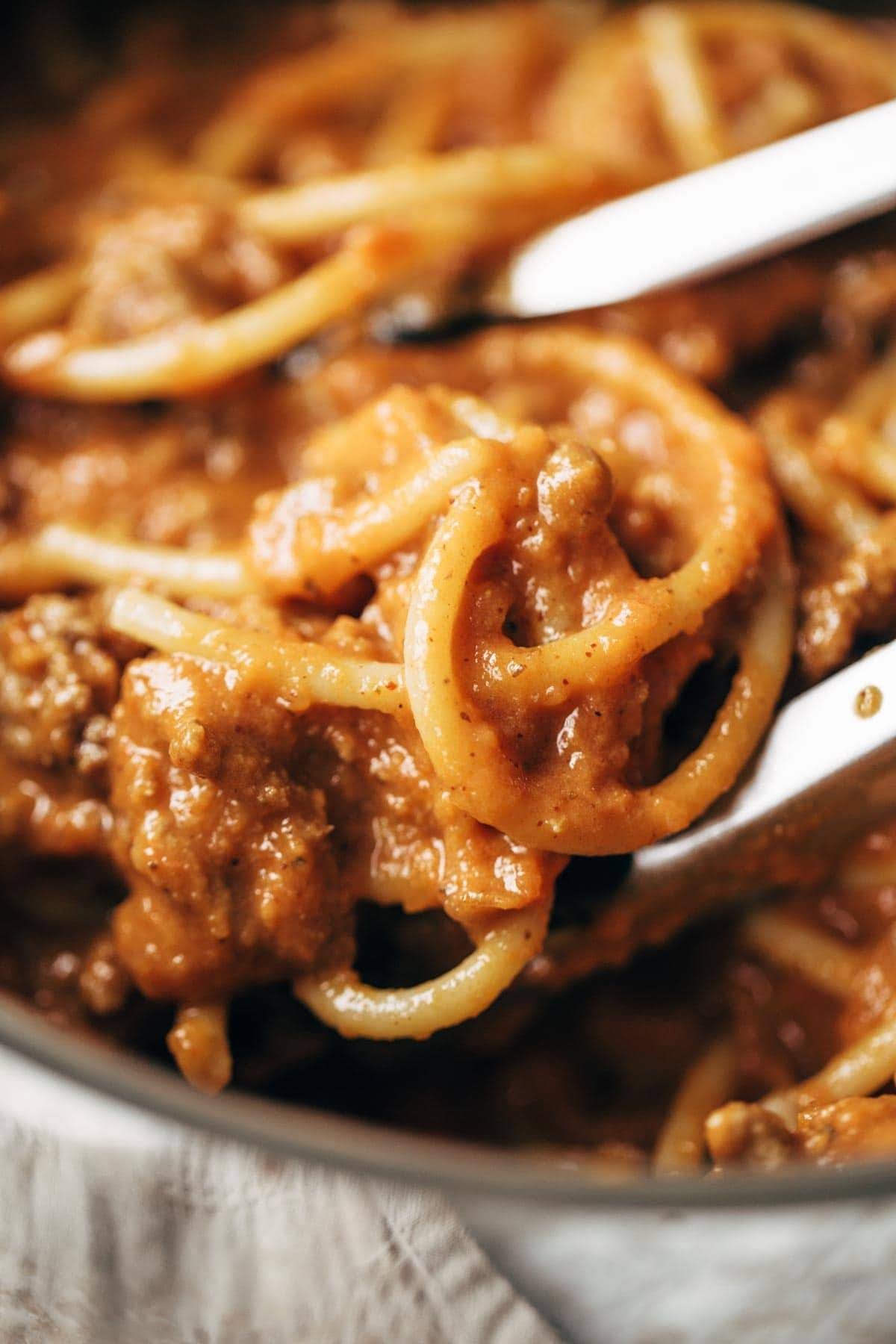 Creamy Pumpkin Spaghetti with Garlic Kale - this is the most crazy good combination! Spicy turkey, creamy pumpkin sauce, and pasta! | pinchofyum.com