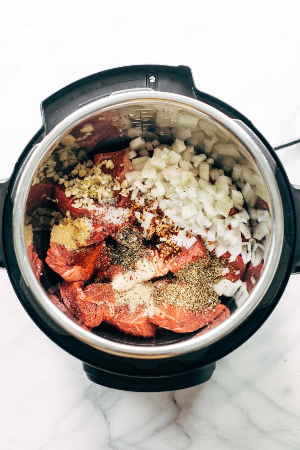 Ingredients for Italian beef recipe in an Instant Pot.