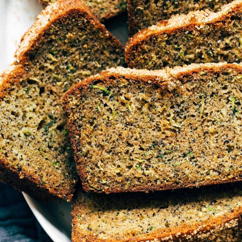 Slices of lemon zucchini bread in a bowl.